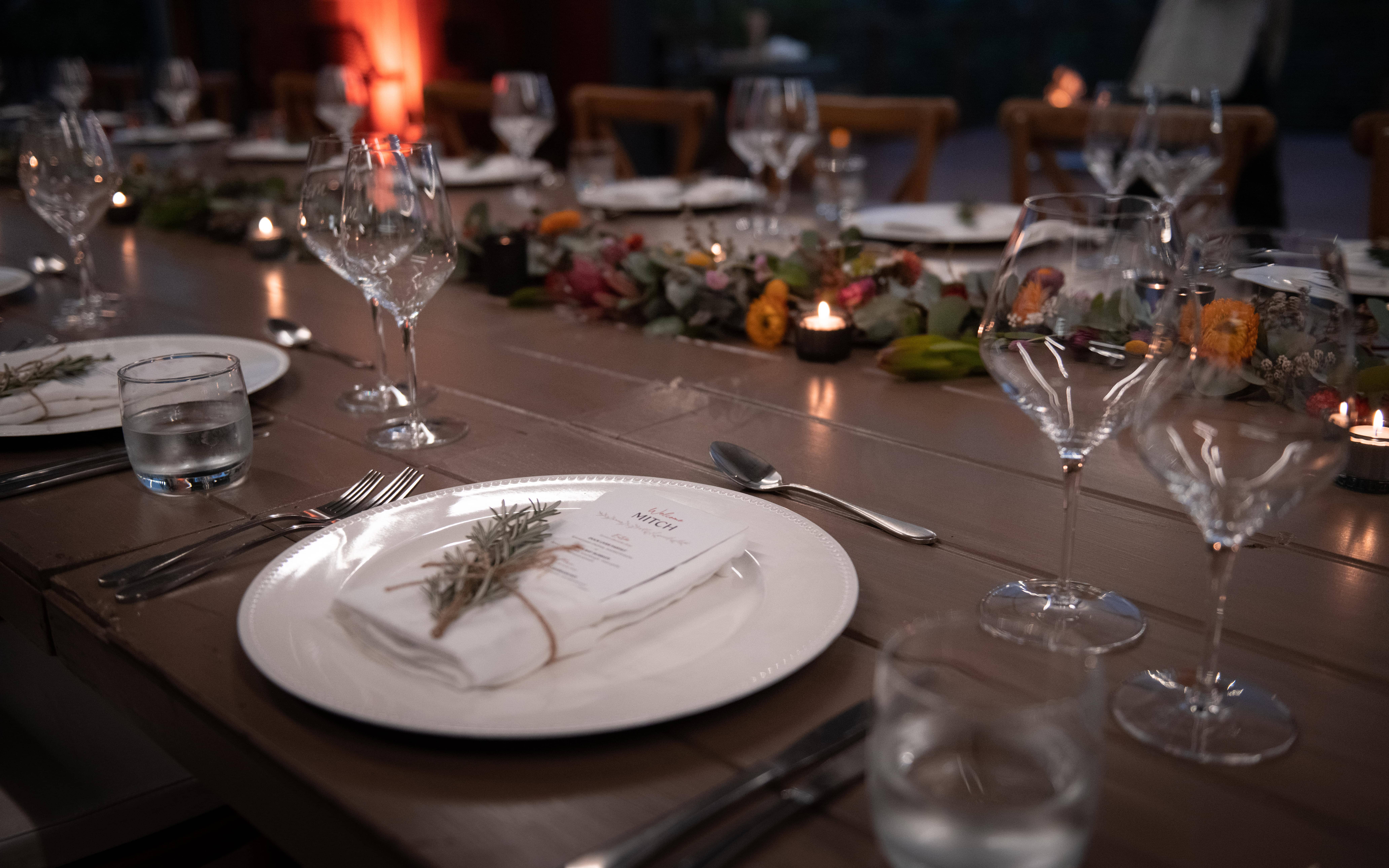 Real-wedding-Luke-and-Mitch-at-The-Crocodile-Lodge-Australia-Zoo-Queensland-wedding-reception-table-with-plates-wine-glass-and-cutleries
