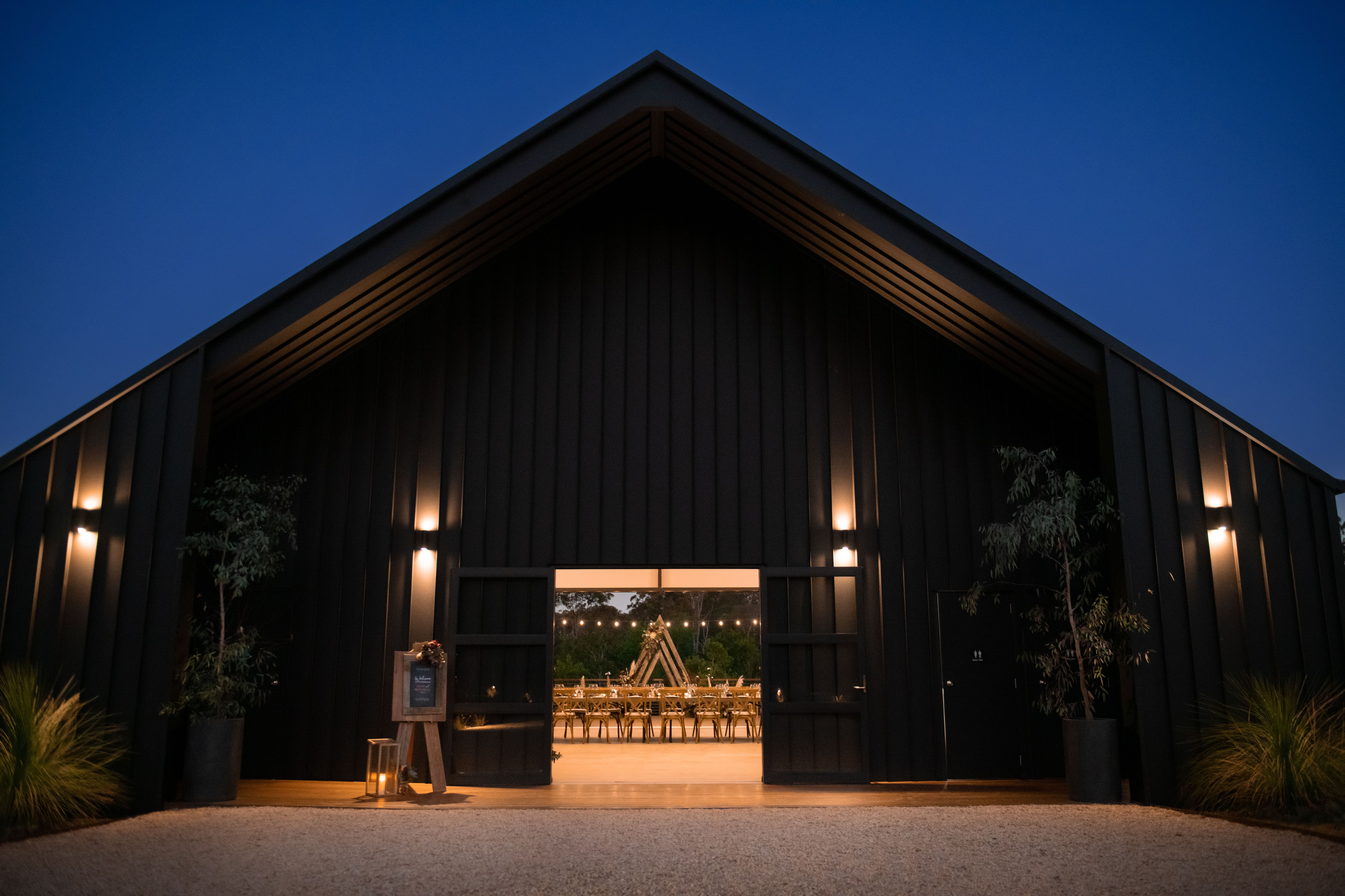 Real-wedding-Luke-and-Mitch-at-The-Crocodile-Lodge-Australia-Zoo-Queensland-wedding-venue-exterior-during-nighttime