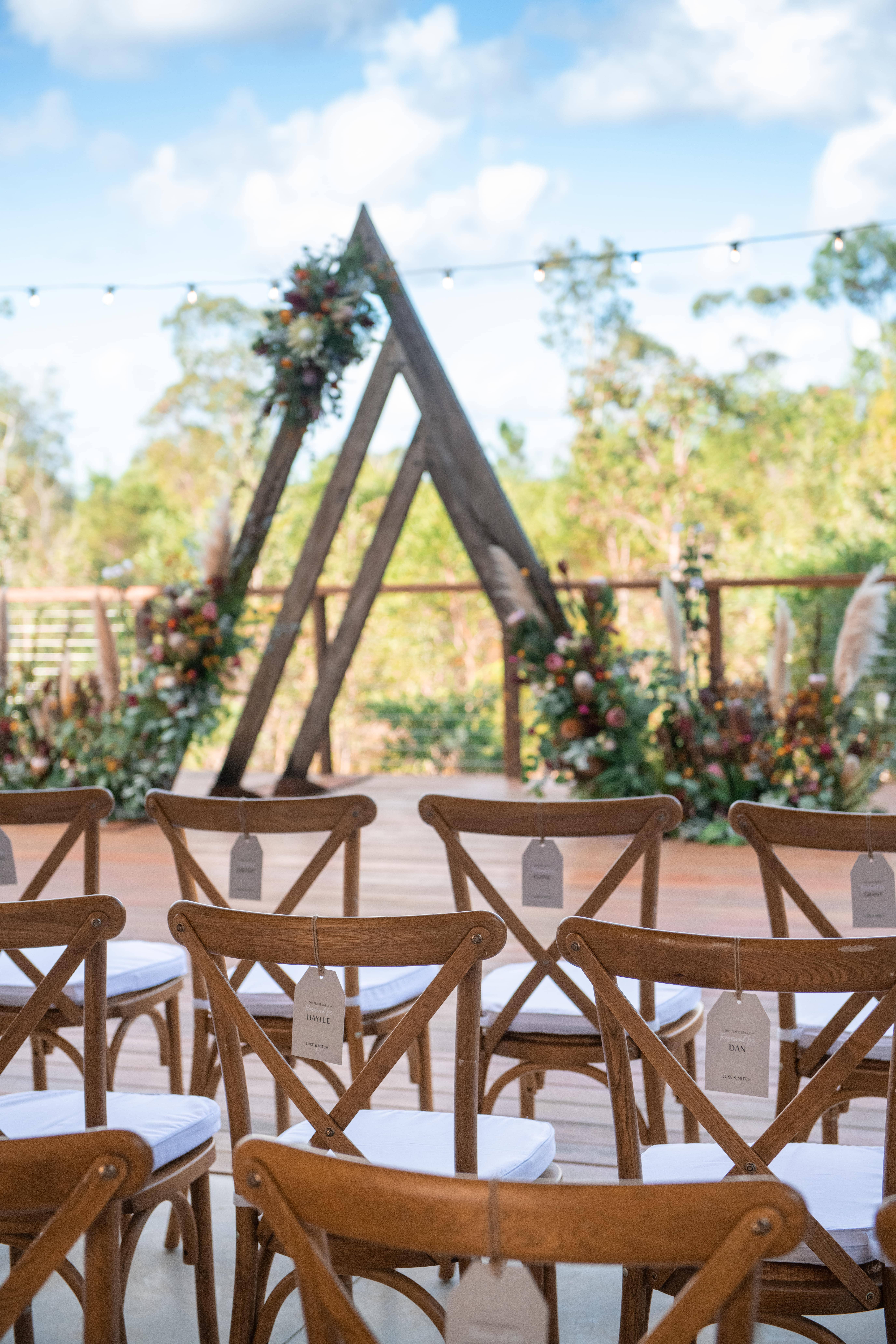 Real-wedding-Luke-and-Mitch-at-The-Crocodile-Lodge-Australia-Zoo-Queensland-wedding-venue-with-arch-and-chairs