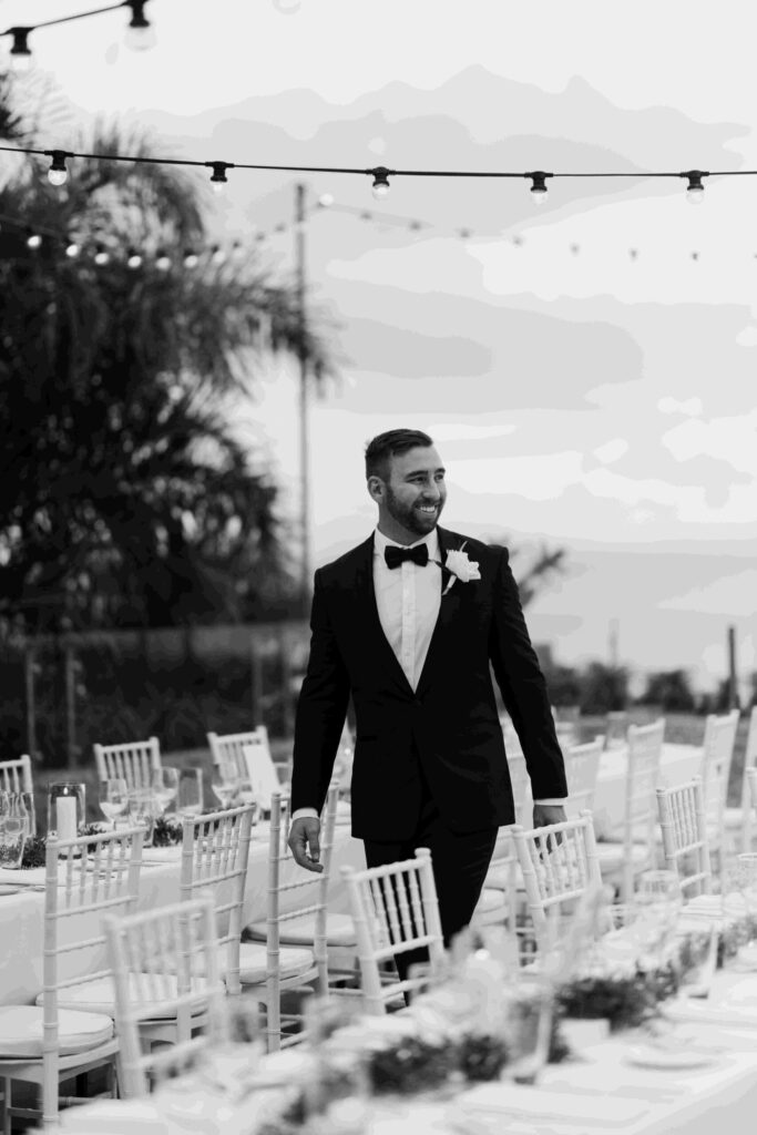 Real-wedding-Teagan-and-Luke-Villa-Botanica-Whitsundays-Australia-by-Rolling-Portraits-newlywed-portrait-post-ceremony-reception-area-groom-walking