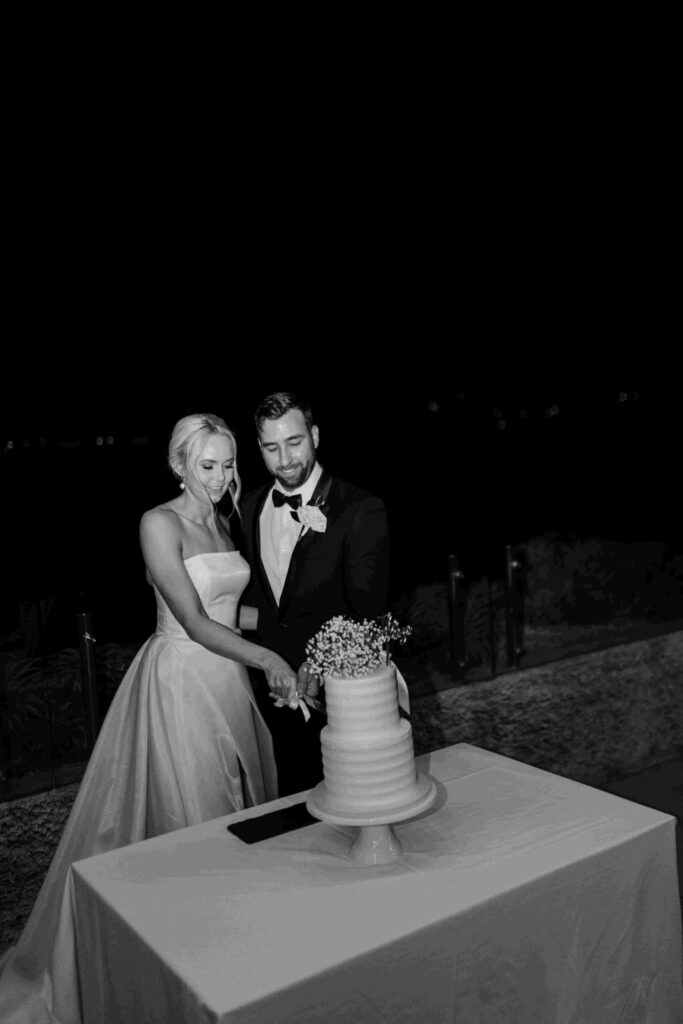 Real-wedding-Teagan-and-Luke-Villa-Botanica-Whitsundays-Australia-by-Rolling-Portraits-newlywed-portrait-post-ceremony-reception-area-bride-and-groom-slicing-the-cake