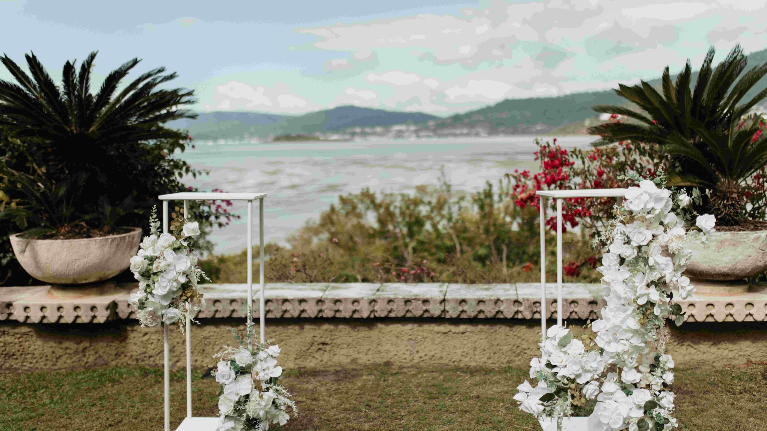 Real-wedding-Teagan-and-Luke-Villa-Botanica-Whitsundays-Australia-by-Rolling-Portraits-wedding-venue-with-wedding-arch-and-flowers-or-floral-decoration