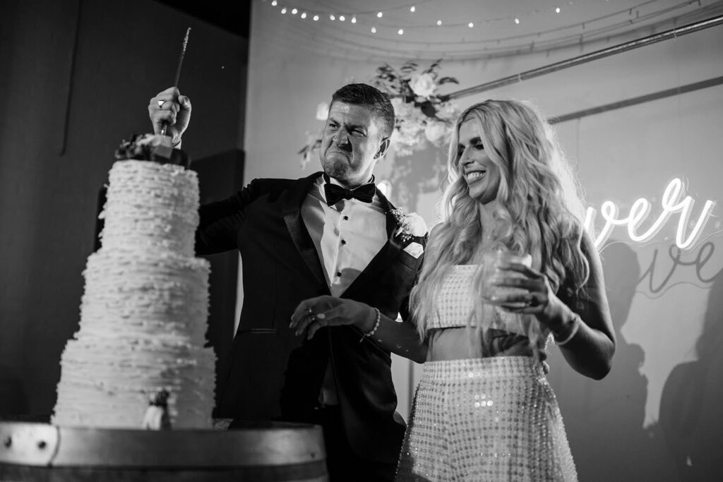 Real Wedding - Brittany + Edward - Bimbadgen Palmers Lane, Hunter Valley - The Beginning Studio - bride and groom slicing the cake