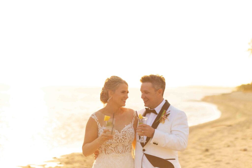 Kylee & Jason at Outrigger Fiji Beach Resort - images by Ocean Studio Fiji - bride and groom walking at the beach during sunset