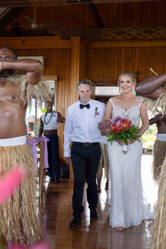 Kylee & Jason at Outrigger Fiji Beach Resort - images by Ocean Studio Fiji - bride walking towards the groom on the aisle