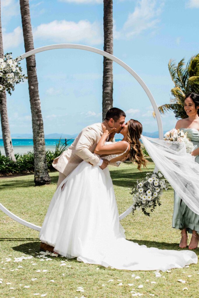 Real Wedding - Arthur and Gabby - Intercontinental Hayman Island by Timeless images by Vanessa - bride and groom kiss during ceremony