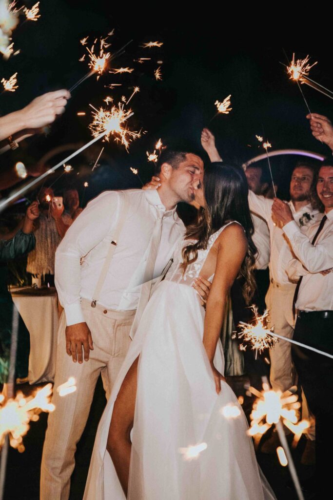 Real Wedding - Arthur and Gabby - Intercontinental Hayman Island by Timeless images by Vanessa - bride and groom kiss - sparklers
