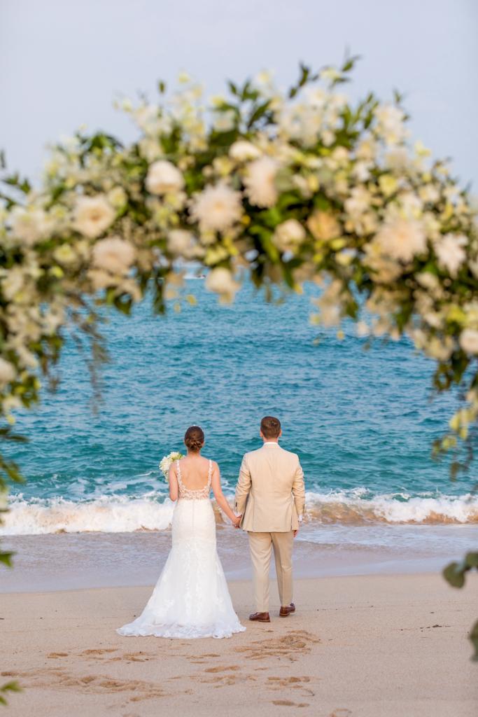 Real Wedding - Lucy + Liam, Garrya Tongsai Bay Samui - newlywed couple portrait facing the beach